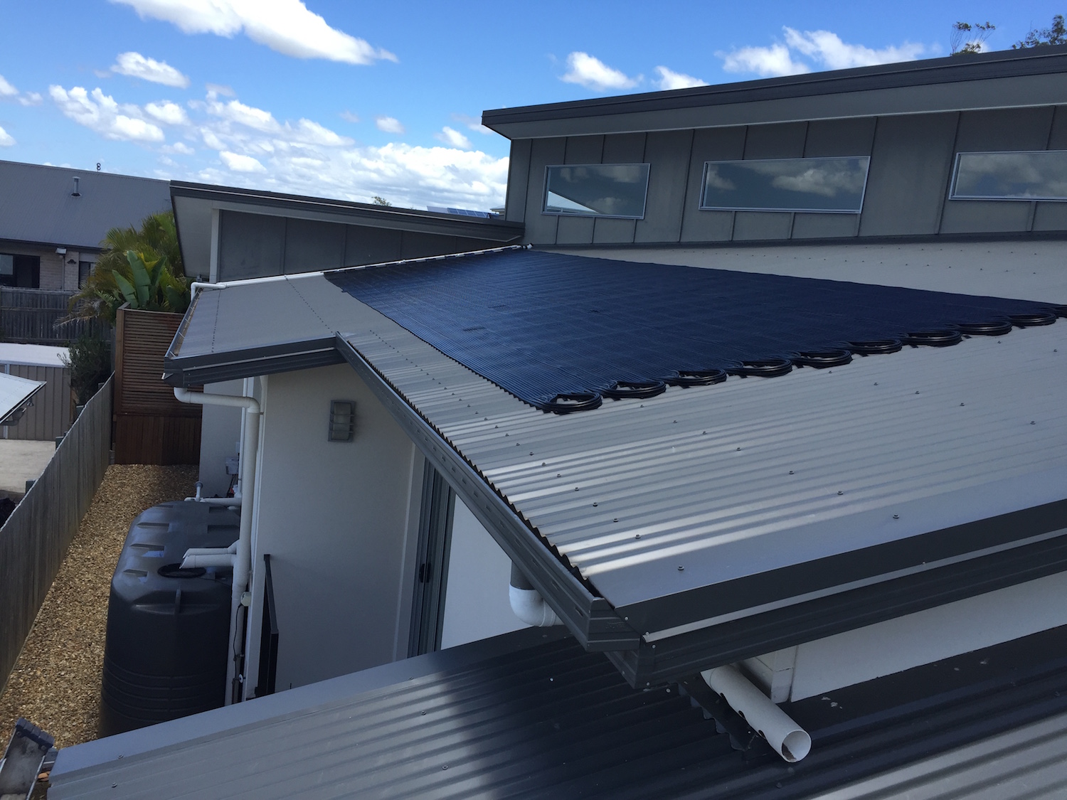 Solar pool heating panels on a roof