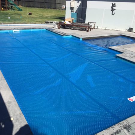 Eco Solar Pool Heating - Dairy pool blanket and roller